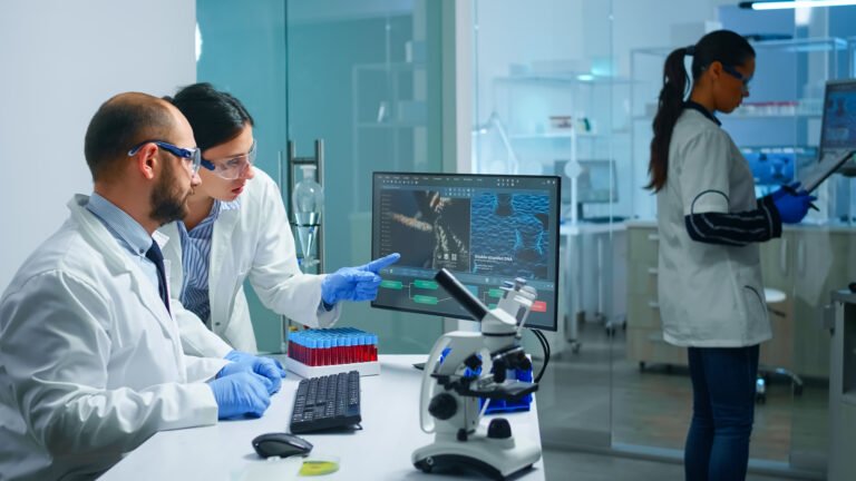 Chemist doctor explaining to coworker vaccine development