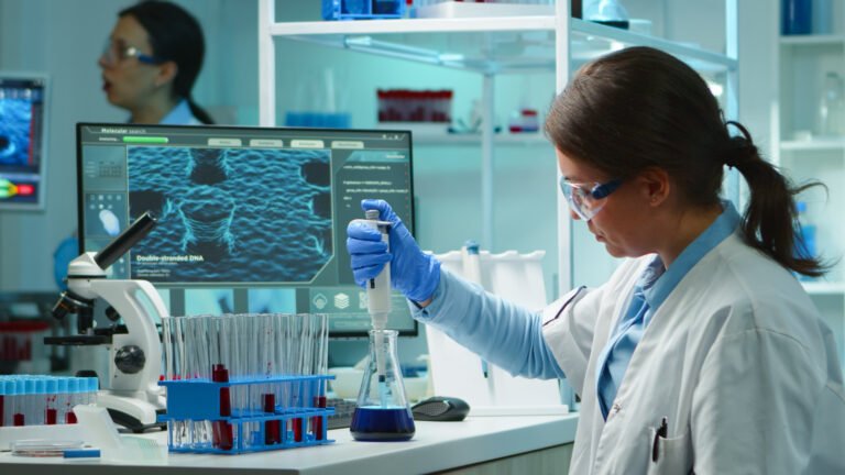 scientist-woman-pipetting-liquid-test-tube-late-night-modern-equipped-lab-team-examining-virus-evolution-using-high-tech-scientific-analysis-treatment-development-against-covid19
